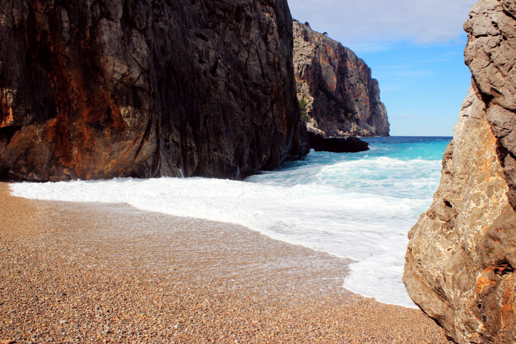 the sea washing up on a mallorca beach