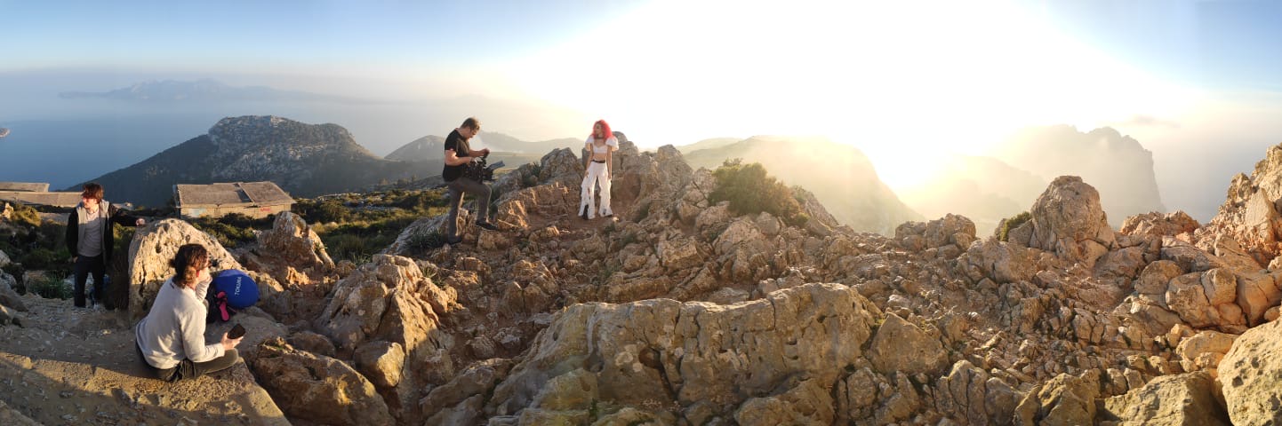 sai losada stands on a mountain for a music video shot in palma