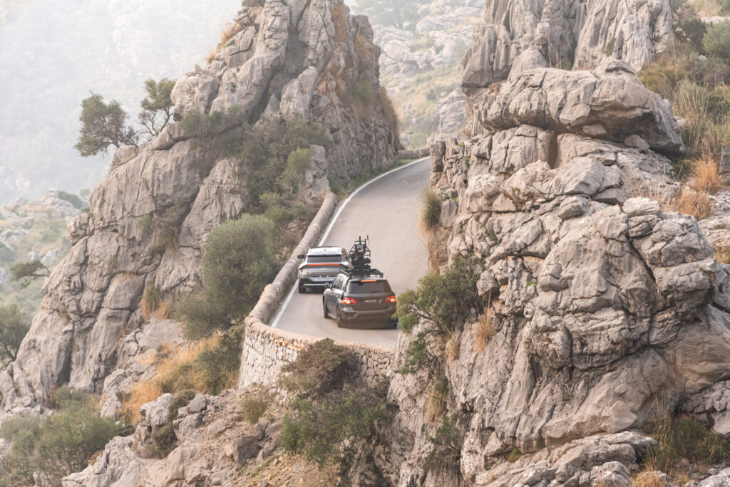 scorpio arm car following the picture vehicle on a mountain road in mallorca, shot from long distance, filming for Kia x Nadal car commercial 