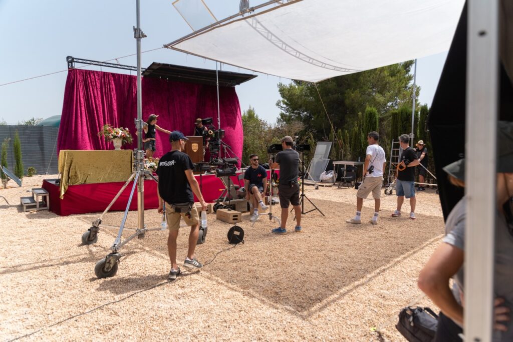 film crew builds the set for the next scene